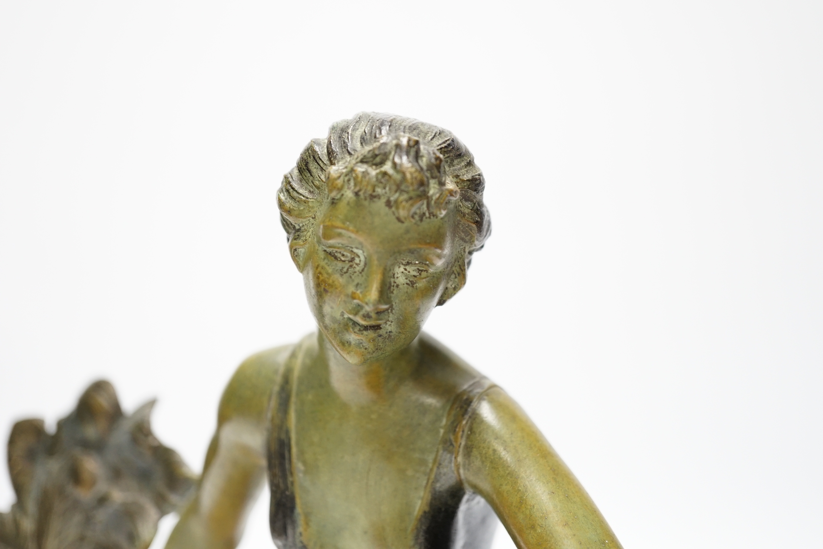 An Art Deco patinated spelter and marble figure, signed A. Leclerc, 40cm wide